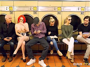 Flame haired Jasmine James gets jammed in the launderette