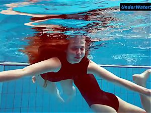 two steaming teens underwater