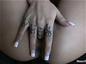 inked up Mason Moore thumbs her puss on the couch